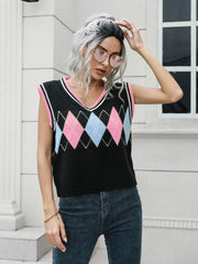 Argyle sweater vest in black with pink and blue diamonds, pink trim, V-neck, sleeveless.
