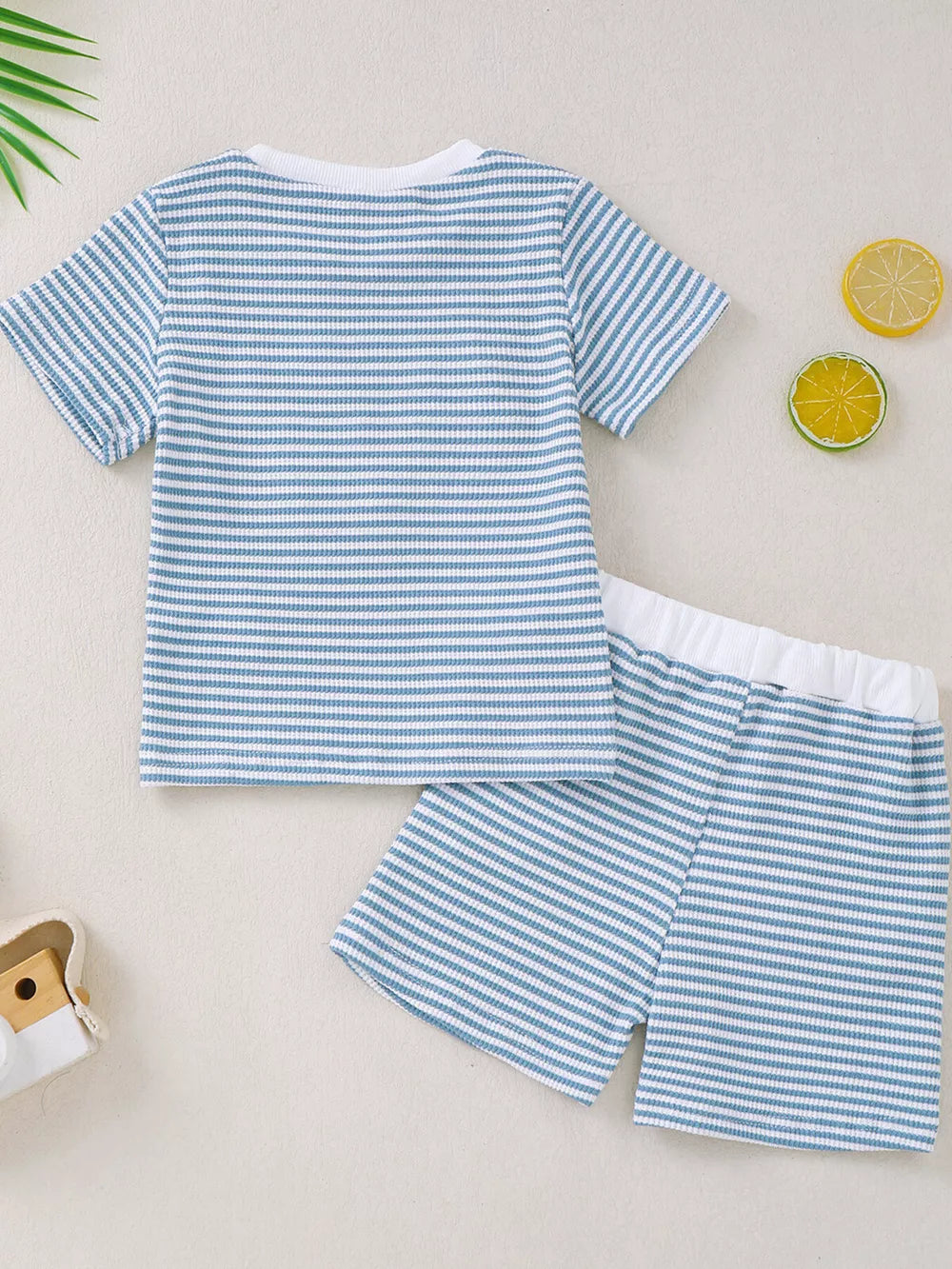 Blue and white striped baby tee and shorts set with white trim.