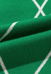 Dark green argyle knit sweater with white diamond pattern detail