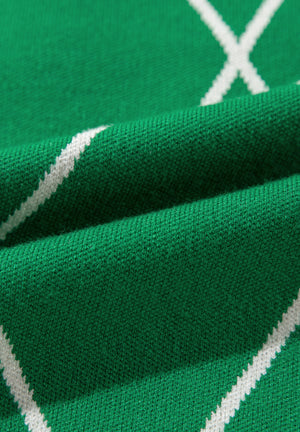 Dark green argyle knit sweater with white diamond pattern detail
