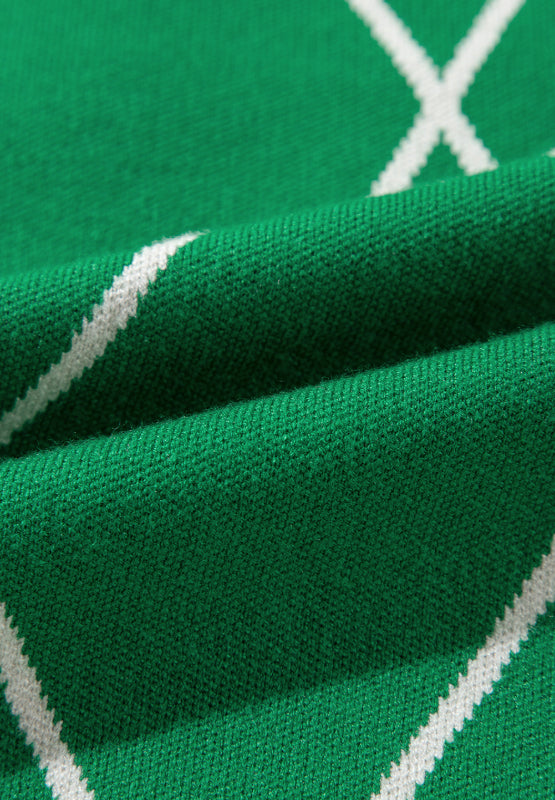 Dark green argyle knit sweater with white diamond pattern detail