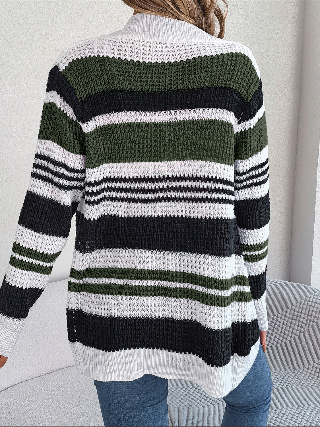 Colorblock open-front knit cardigan with horizontal stripes in army green, black, and white.