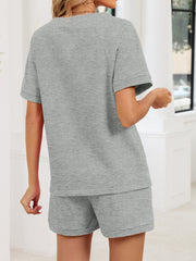 Gray loungewear shorts and matching t-shirt with short sleeves.