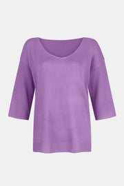 Lavender V-neck knit sweater with flared 3/4 sleeves and ribbed cuffs.