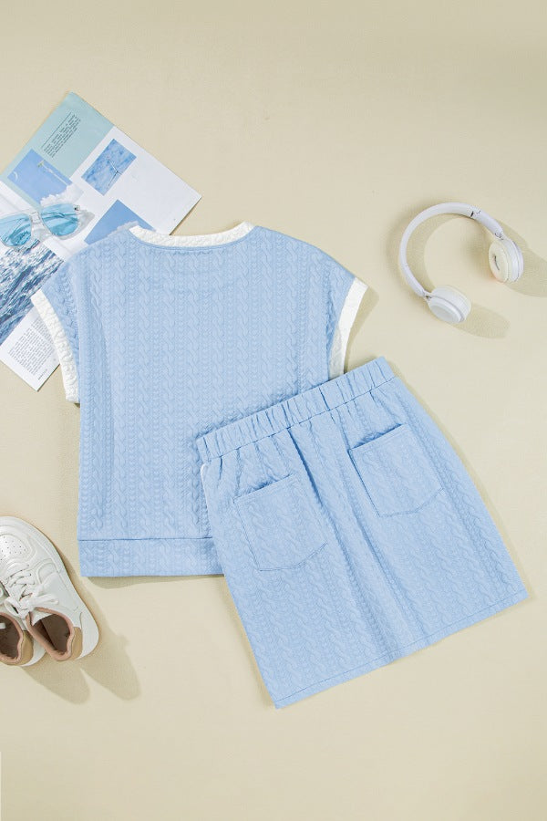 Light blue cable knit loungewear set with crew neck top and elastic waist shorts with pockets.
