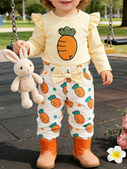 Baby girl's yellow carrot print outfit with ruffled sleeves and bow-waist pants.