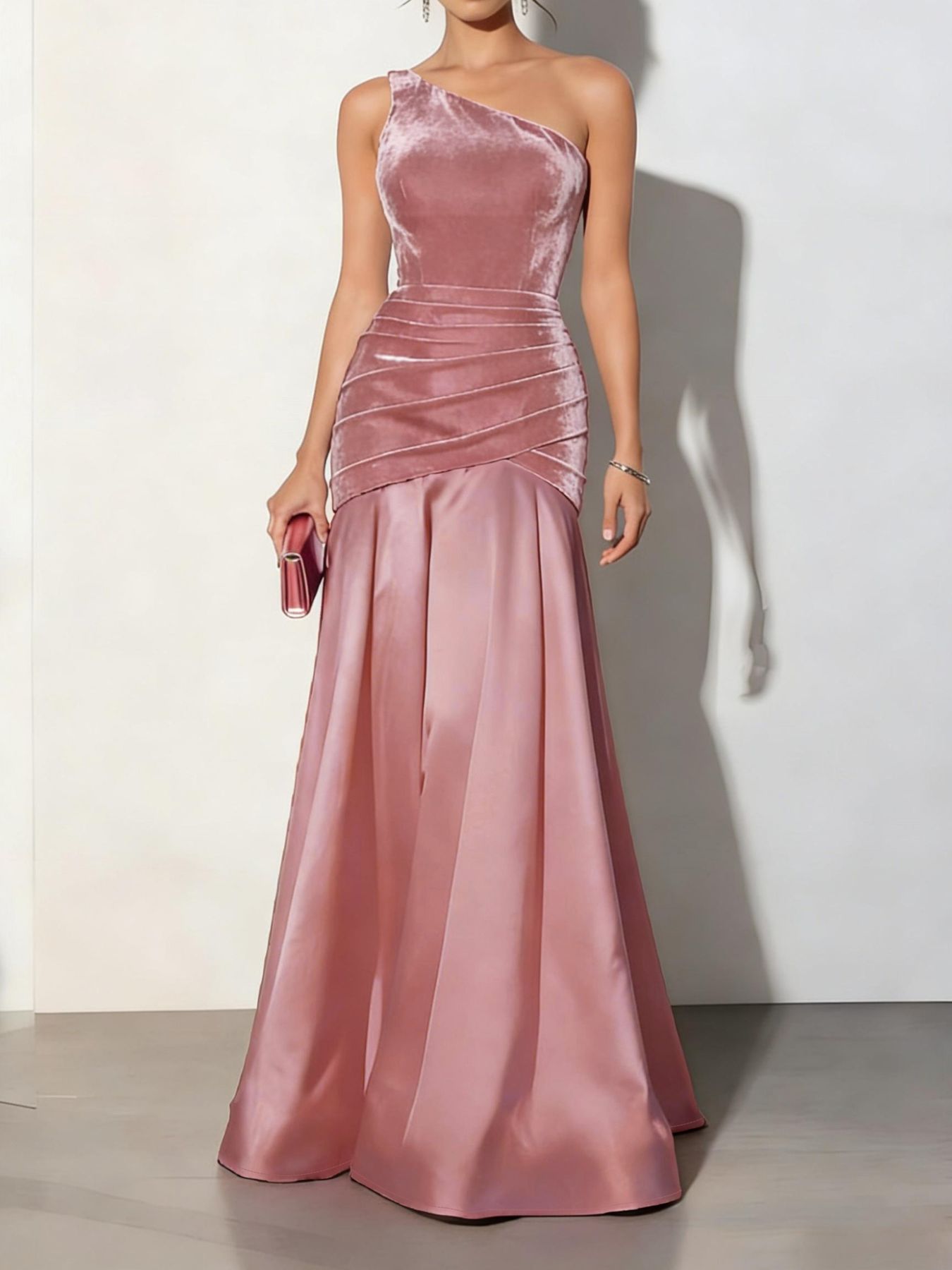 Dusty pink velvet one-shoulder maxi dress with ruched detail and satin skirt.