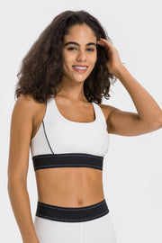 White sports bra with black trim and band, scoop neck, racerback detail