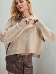 Dotted knit cropped crewneck sweater in Dust Storm acrylic with crewneck and long sleeves.