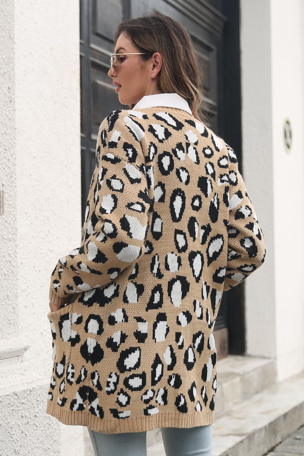 Leopard knit longline cardigan with pockets, acrylic material.