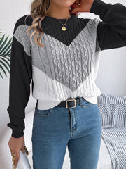 Chevron cable knit sweater with contrast gray, white, and black colorblock design.