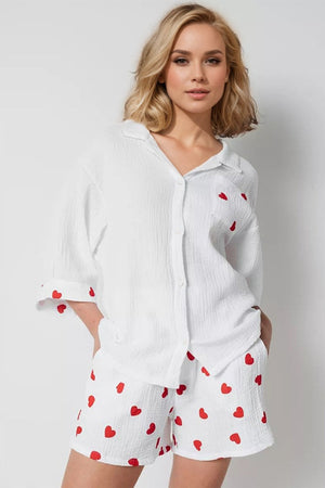 White gauze pajama set with red heart print, collared button-up shirt and shorts.