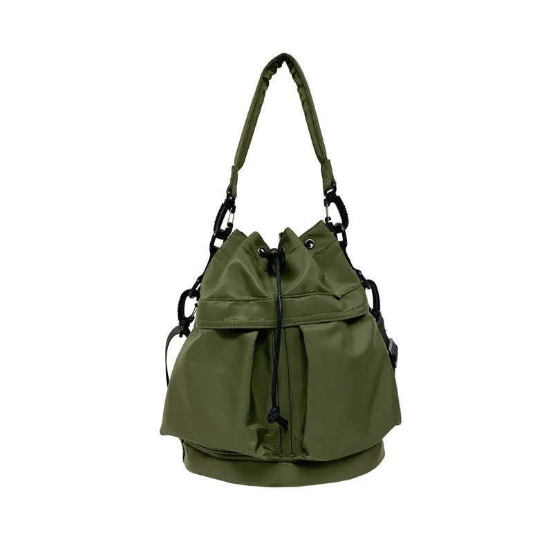 Moss green nylon bucket bag with drawstring closure and chain detail.