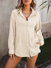 Textured pleat oversized button-down shirt in tan with long sleeves and a collared neckline.