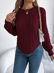 Burgundy acrylic cable knit sweater with asymmetric hem and crew neck.