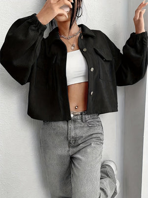 Black corduroy blouson jacket with button front and elastic cuffs.