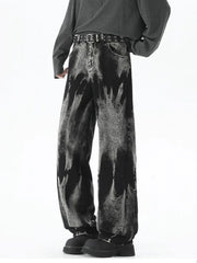 Men's black relaxed fit jeans with acid wash and belted waist.