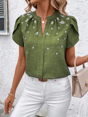 Matcha green embroidered floral keyhole blouse with flutter sleeves.