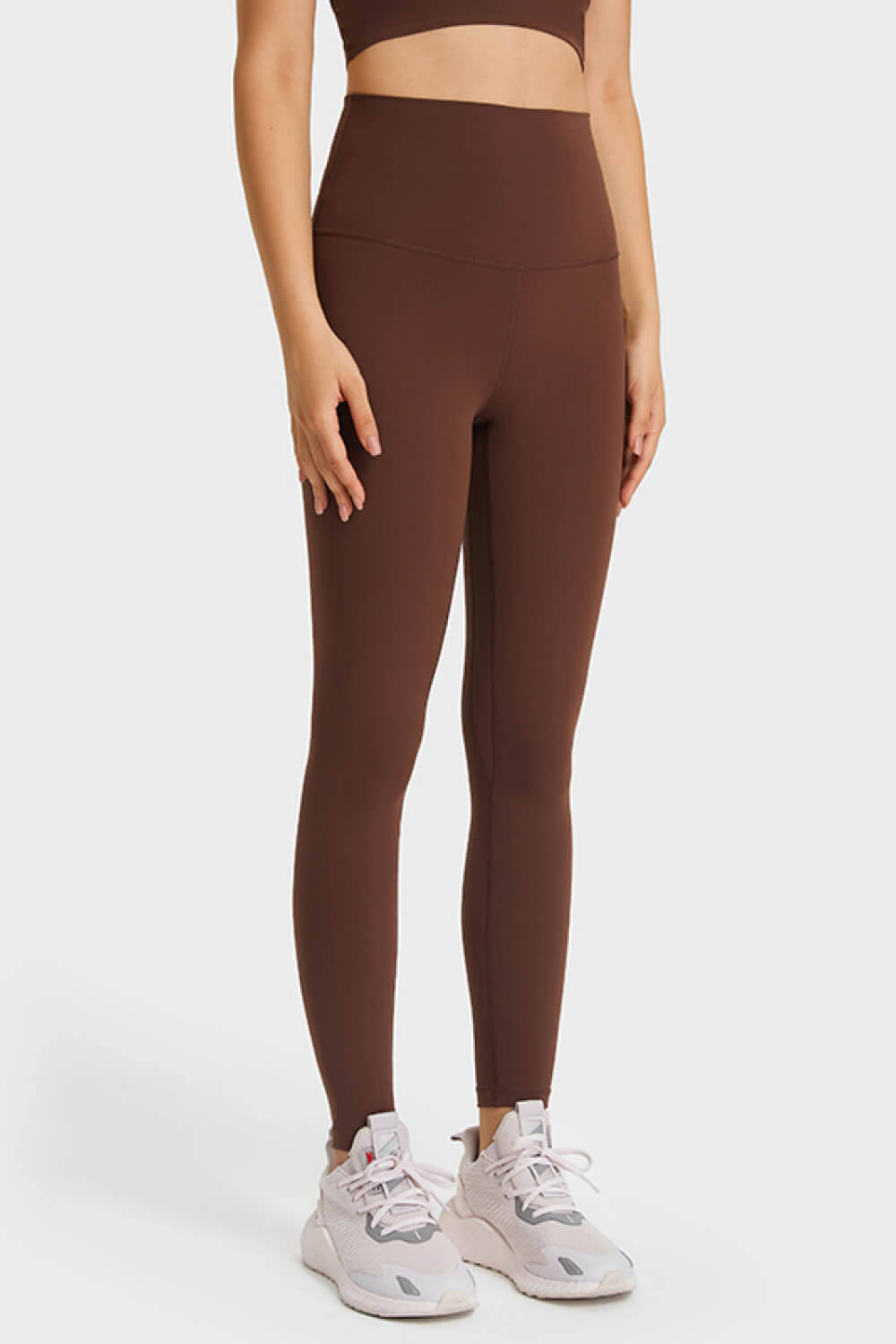 Brown high rise leggings with a seamless design and full length.
