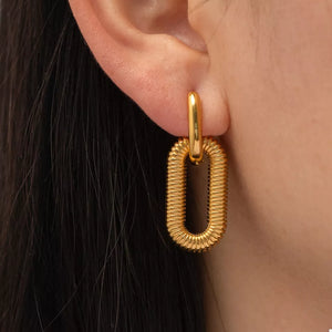 Gold drop earrings with textured oval links and a polished bar top.