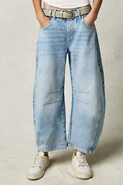 Light blue denim barrel leg jeans with button fly and knee detail