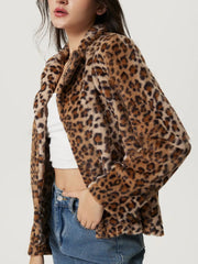 Leopard print faux fur blazer with a buttoned front and lapel collar.