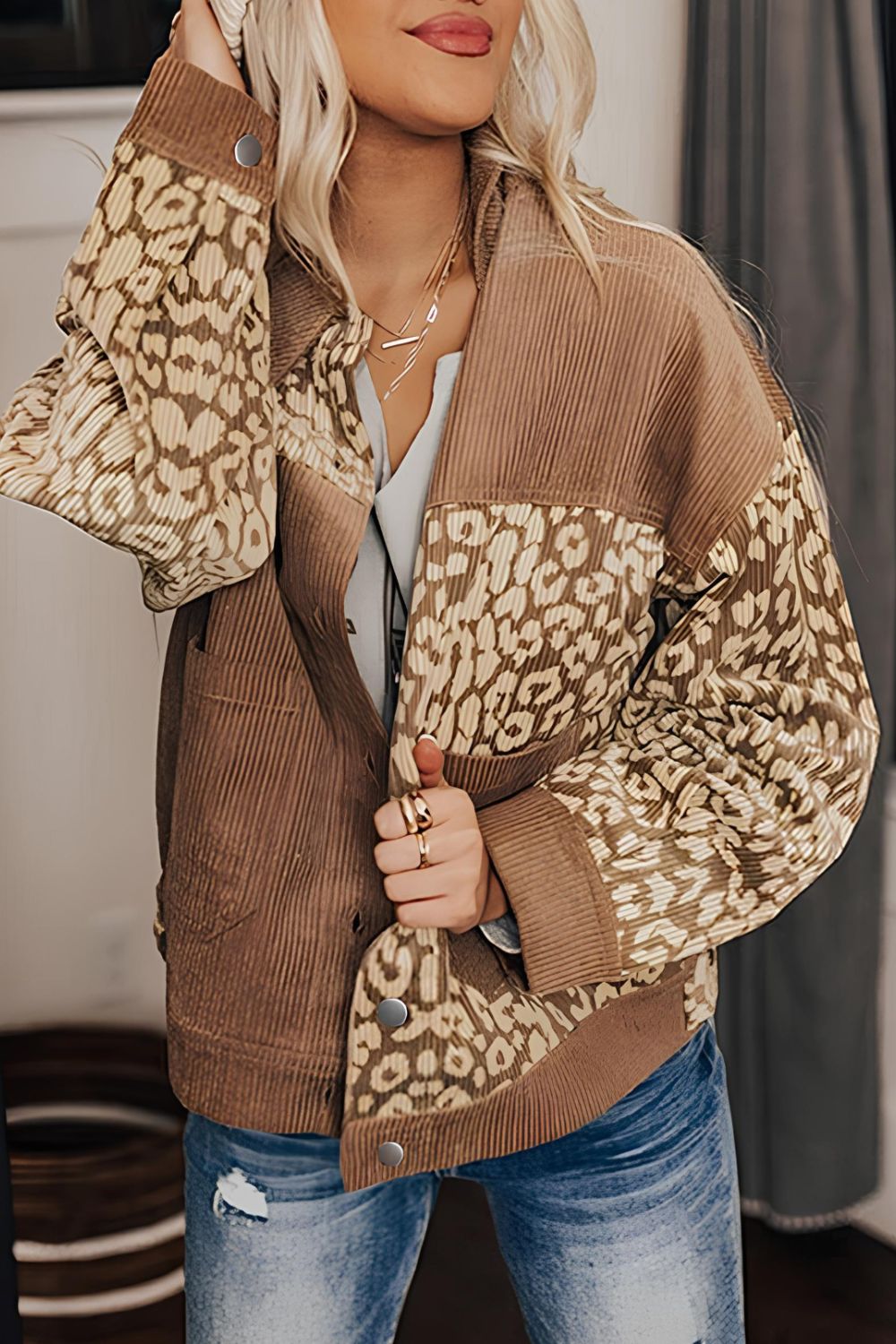 Camel corduroy jacket with leopard print panels and button closure.