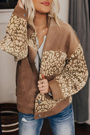 Camel corduroy jacket with leopard print panels and button closure.