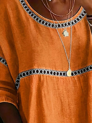 Orange bohemian t-shirt with openwork trim detail and scoop neckline.