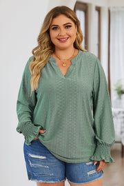 Sage green textured slit-neck blouse with shirred cuffs and eyelet pattern.