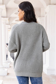 Dark gray oversized ribbed knit cardigan with pockets and button front.