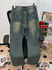 Men's vintage-inspired flare jeans in faded blue denim with distressed details.