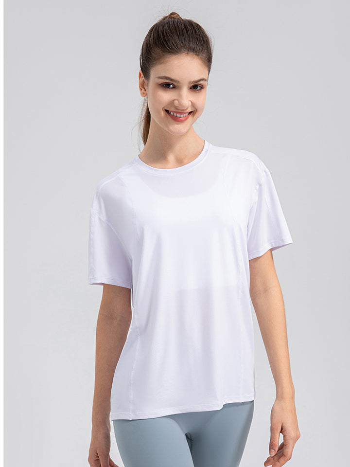 White performance t-shirt with subtle seam details and short sleeves.