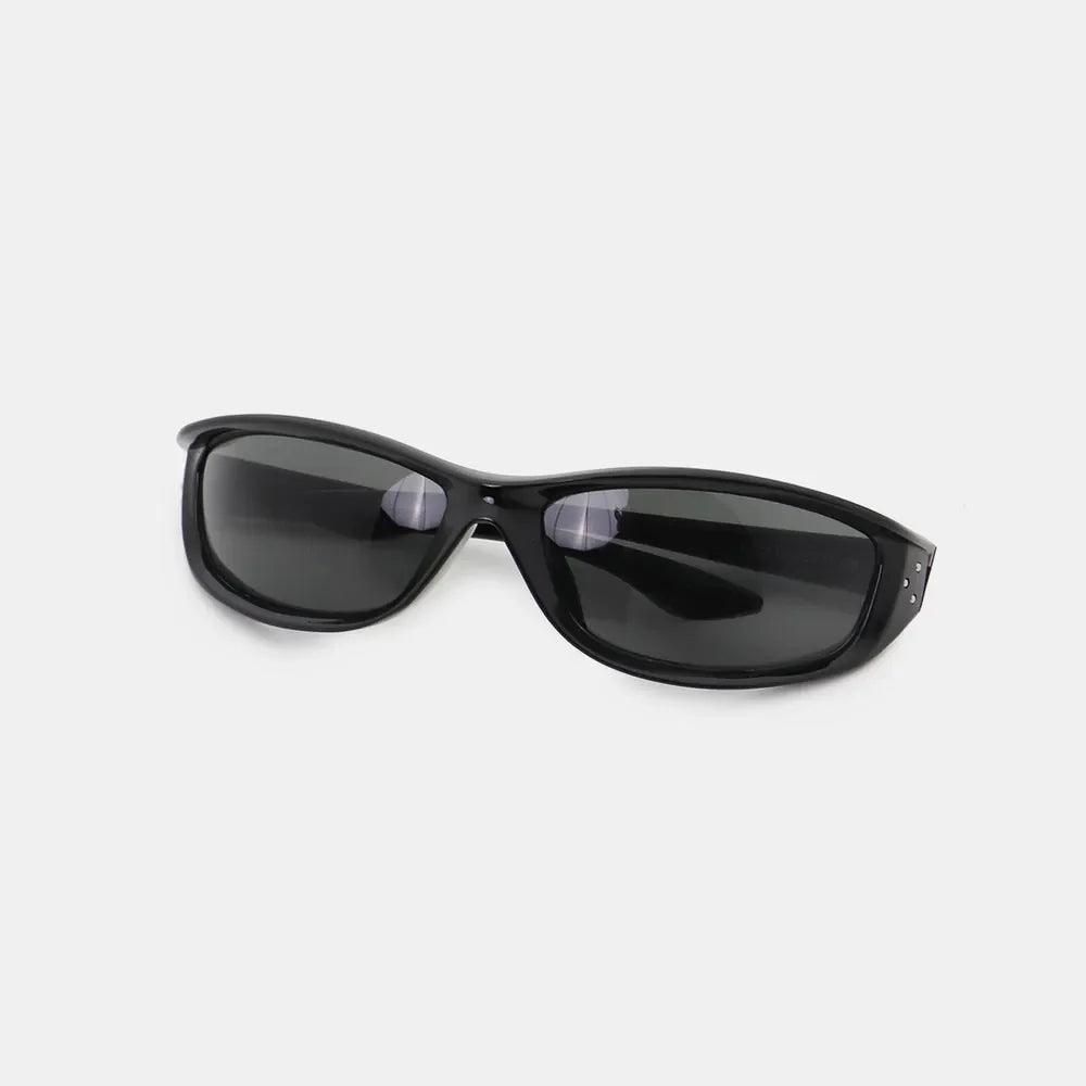 Black sculpted sport sunglasses with dark lenses and studded accents.