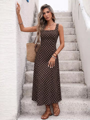 Brown polka dot maxi dress with square neckline and sleeveless design.