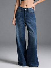 Cutout high-waisted wide-leg jeans in blue denim with button closure.