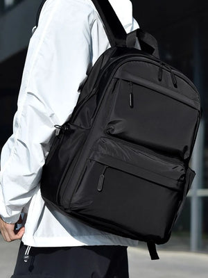 Black urban commuter backpack with multiple exterior zip pockets and side pouch.