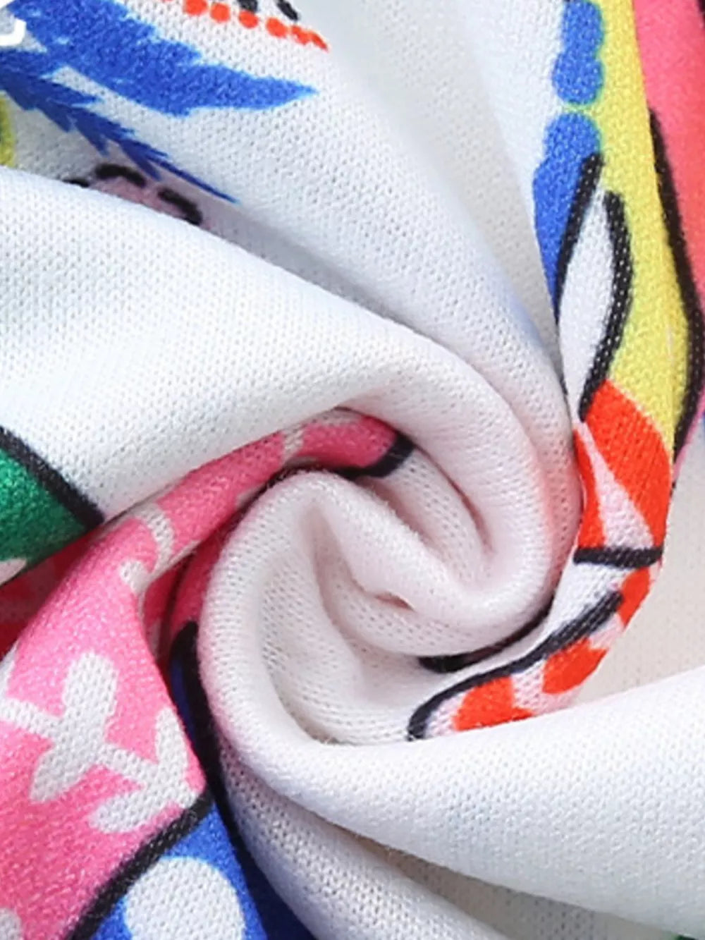 Toddler dress with colorful elephant print and white knit fabric detail.