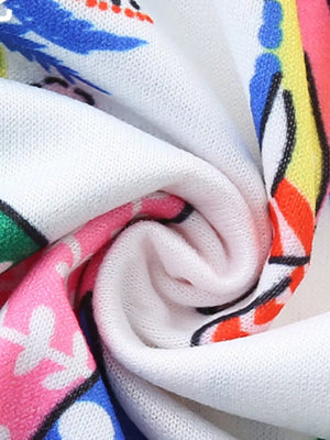 Toddler dress with colorful elephant print and white knit fabric detail.
