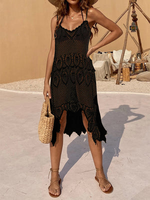 Black crochet midi dress with asymmetric hem and spaghetti straps.