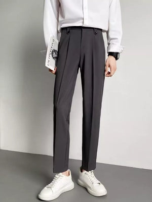 Men's dark gray ankle-length slim fit trousers with double button waist detail.