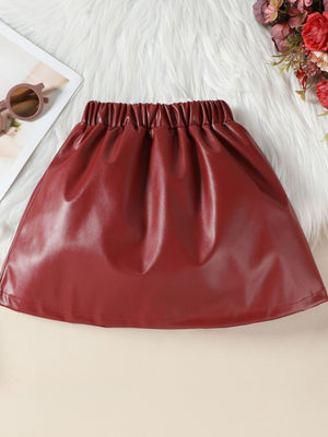 Wine red faux leather toddler skirt with elastic waistband and ruffled detail.