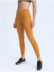 Sculpt leggings in Tangerine with performance pockets and a high waist.
