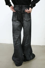 Sculpted flare denim trousers in dark wash with horizontal stripe detailing on the legs.
