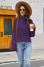 Cropped cable knit turtleneck sweater in plum with a high neck and long sleeves.