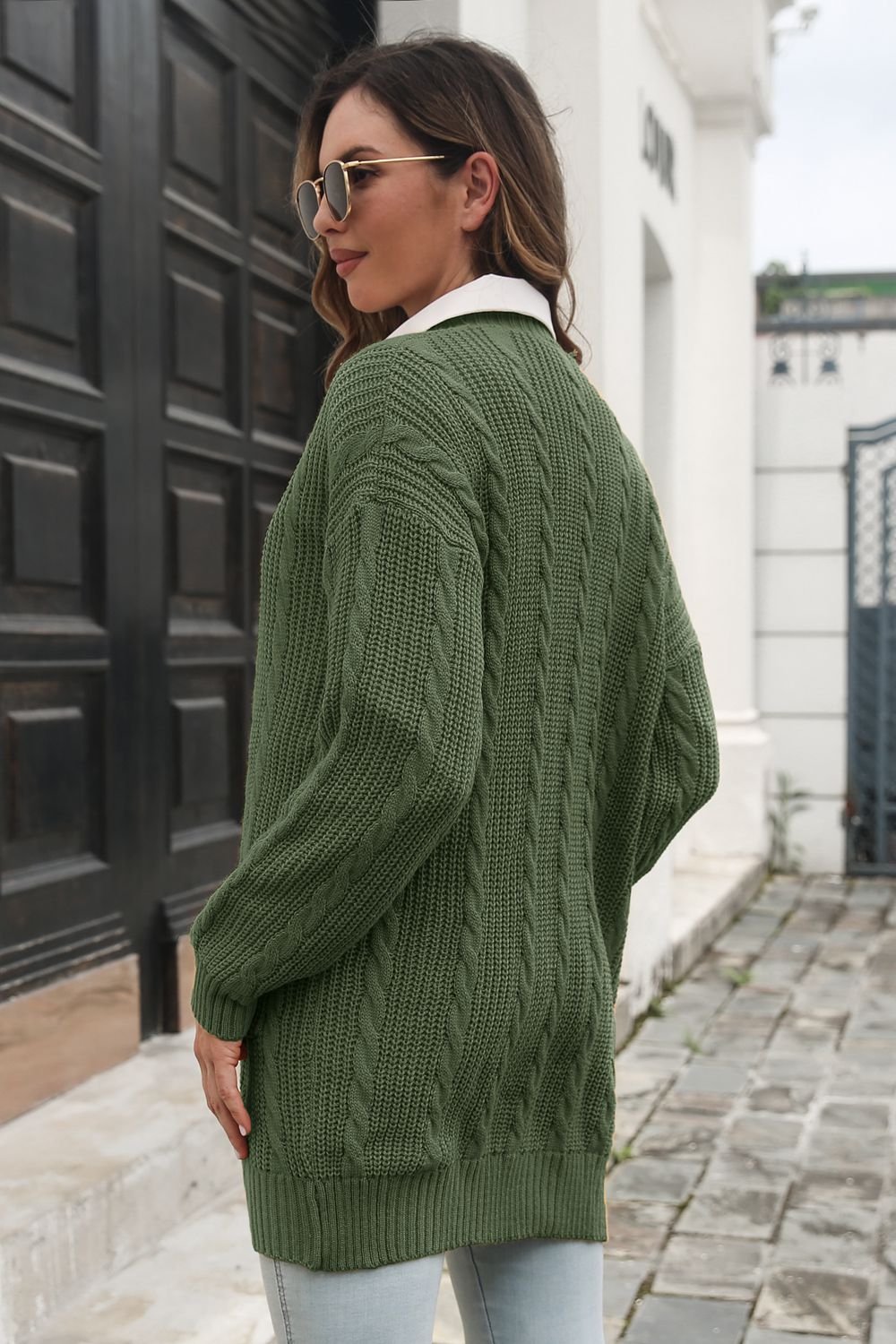 Army green cable knit longline cardigan with a relaxed fit and classic cable details.