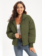Moss green padded bomber jacket with ribbed cuffs and zipper closure.