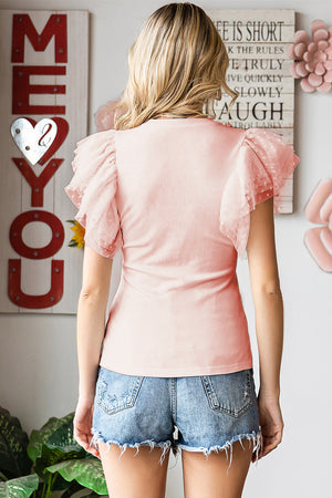 Blush pink ribbed knit top with dot mesh flutter sleeves.