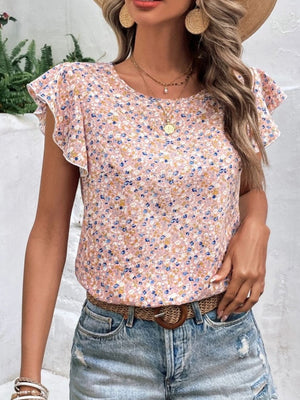 Floral flutter sleeve blouse in pale blush with a ditsy floral print.