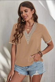 Brown V-neck blouse with lace trim on neckline and sleeves